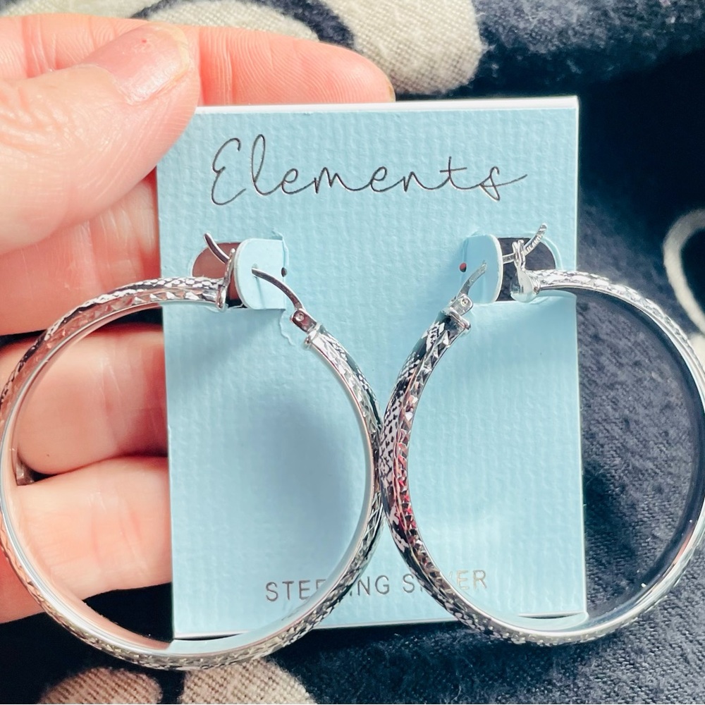 Brand new never worn sterling silver snake inspired hoop earrings